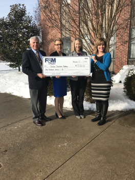 bank staff present check to Shalom official