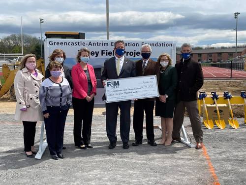 representatives from United Bank Limited and GAEF pose for a photo