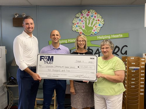 representatives from United Bank Limited and WCHS pictures during check presentation